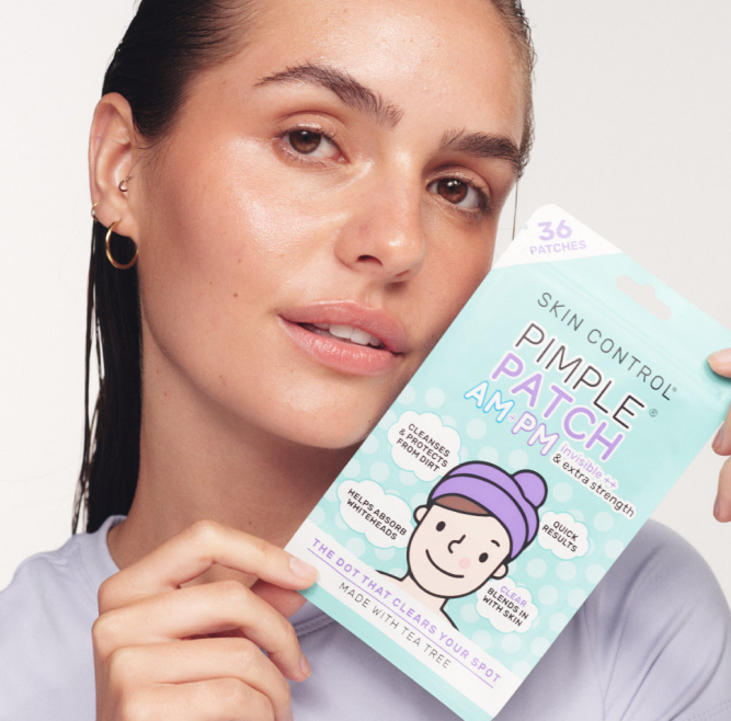 Model holding a Skin Control Pimple Patch AM PM pack